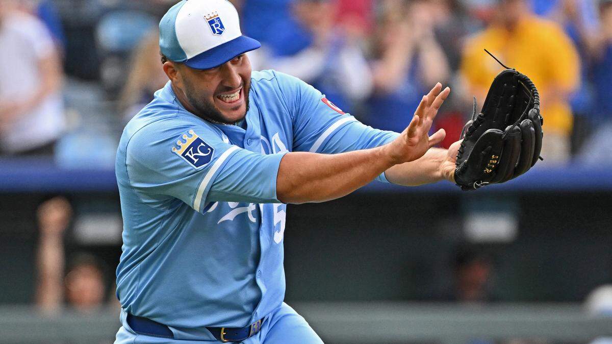Kansas City Royals relief pitcher Carlos Estevez (53) celebrated with a Kamehameha after striking out the final Cleveland Guardians batter for the win at Kauffman Stadium.
