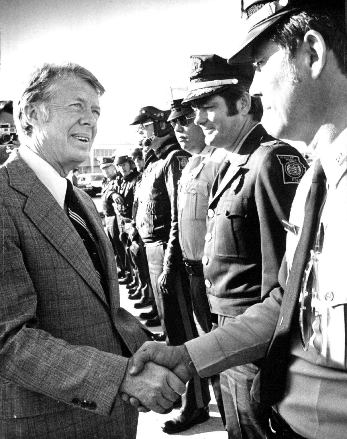 President Jimmy Carter shakes hands with members of the Kansas City Police Department.