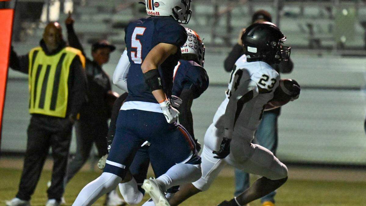 John Price, at far right, takes off for one of his two touchdowns to help Blue Valley to a 17-0 win over Olathe East in Friday night high school football showdown.