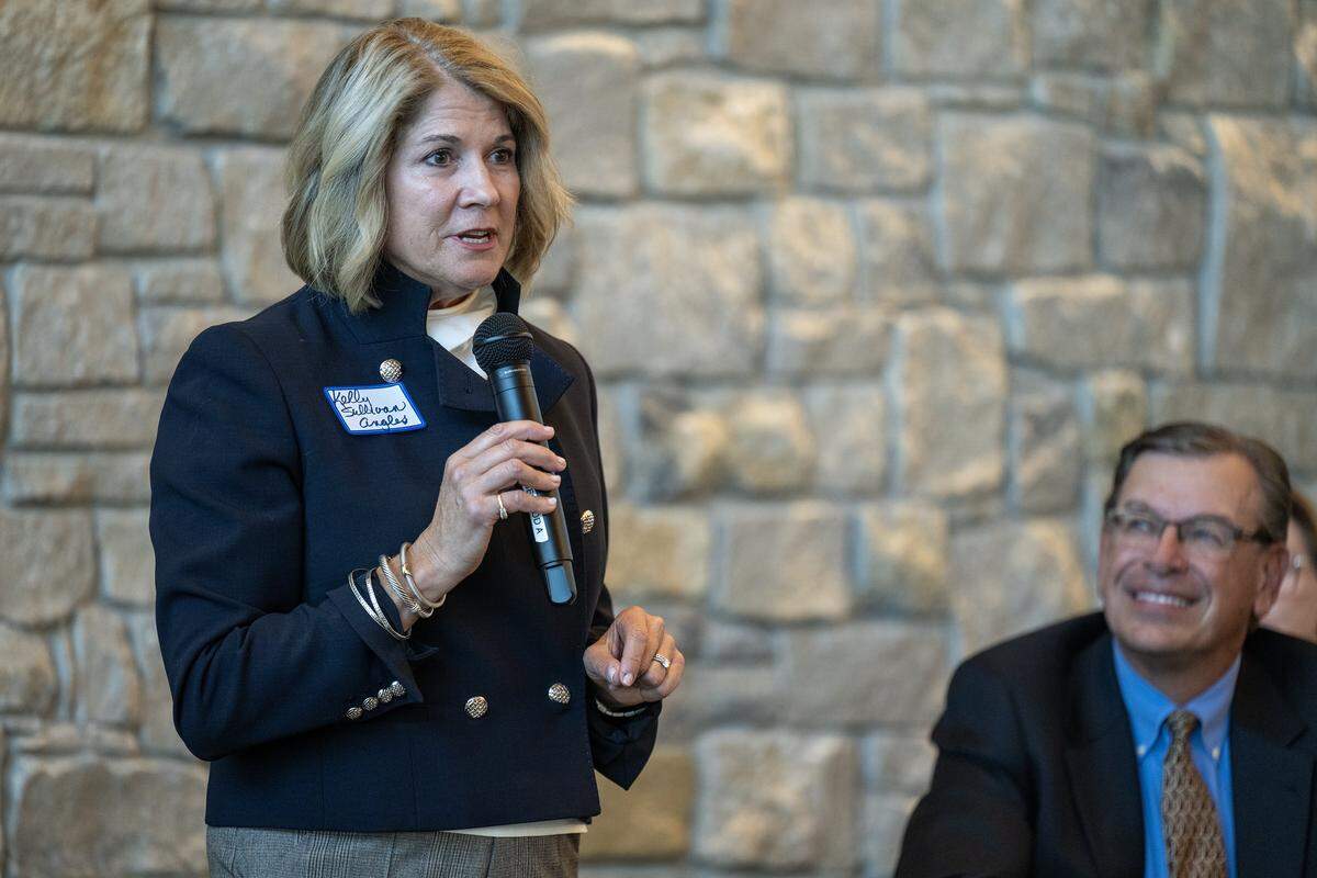 Kelly Sullivan Angles, a candidate for Council Member Ward 4 in Prairie Village, speaks during a candidates forum at the Meadowbrook  Club House in Prairie Village on Thursday, October 9, 2025. Nathan Vallette, right, who is also running for the position Ward 4, looks on. 