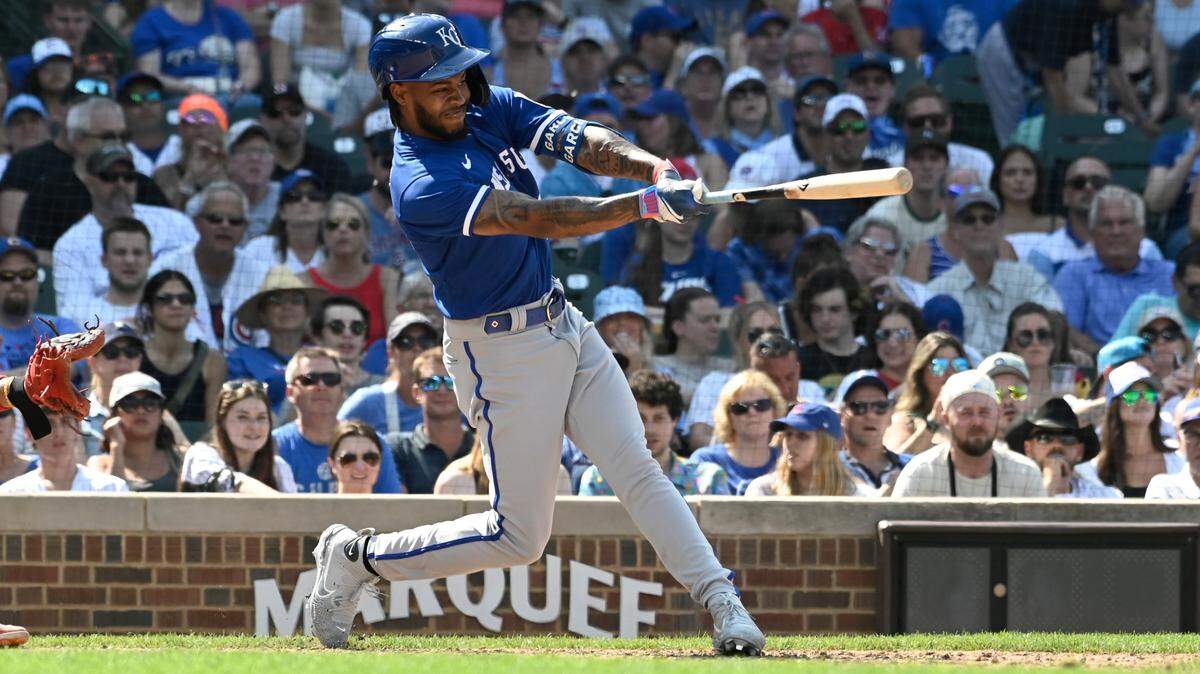 Kansas City Royals third baseman Maikel Garcia hits an RBI single during Sunday afternoon’s game against the Chicago Cubs at Wrigley Field.