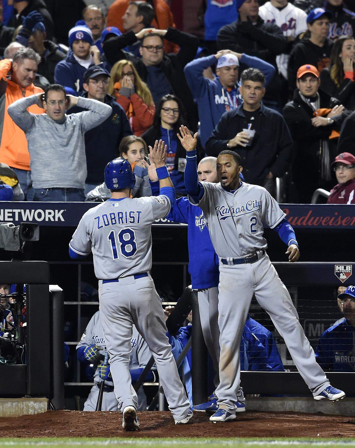 Kansas City Royals shortstop Alcides Escobar celebrated with second baseman Ben Zobrist after Zobrist scored on a single hit by first baseman Eric Hosmer in the eighth inning during Game 4 of the World Series on Saturday, October 31, 2015 at Citi Field in New York.