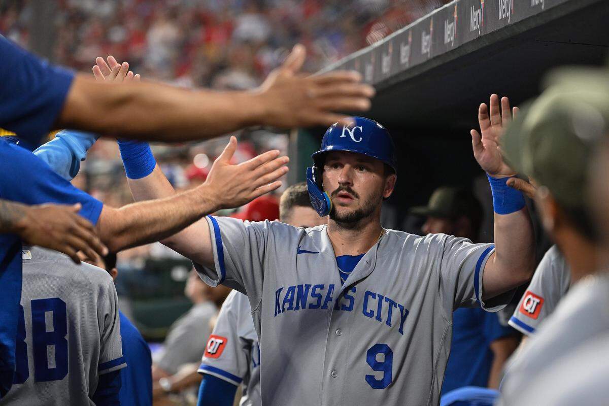 Kansas City Royals slugger Vinnie Pasquantino high-fives teammates in the dugout after scoring against the Cardinals during a series opener at Busch Stadium in St. Louis on Friday, May 15, 2026.