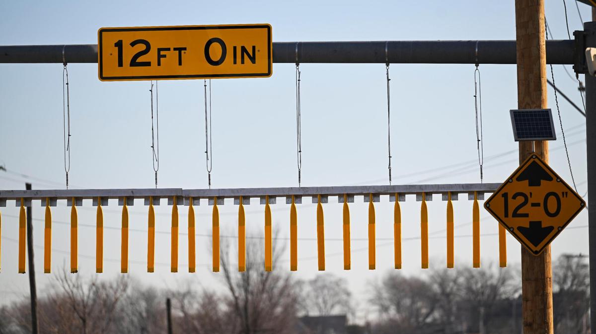 The Independence Avenue railroad bridge between Wilson Avenue and White Avenue is known for damaging trucks as they attempt to pass under the 12-foot high bridge. A bridge curtain, seen here on Friday, Feb. 2, 2024, was just installed to warn truck drivers of the low height before they reach the bridge.