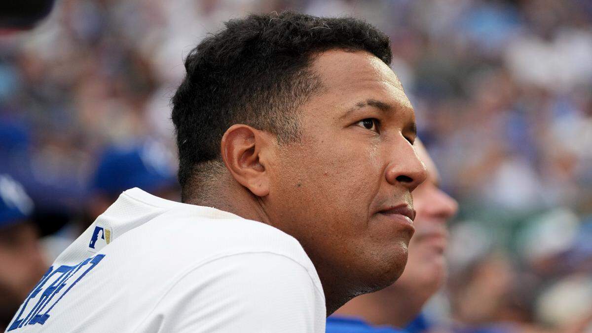 Kansas City Royals designated hitter Salvador Perez (13) watches the scoreboard against the New York Yankees from the dugout in the fifth inning at Kauffman Stadium on June 12, 2025.