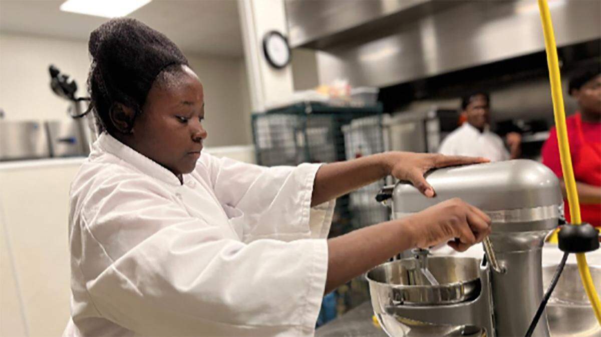 Semahj Ware in the culinary arts lab at Operation Breakthrough's Innovation Lab