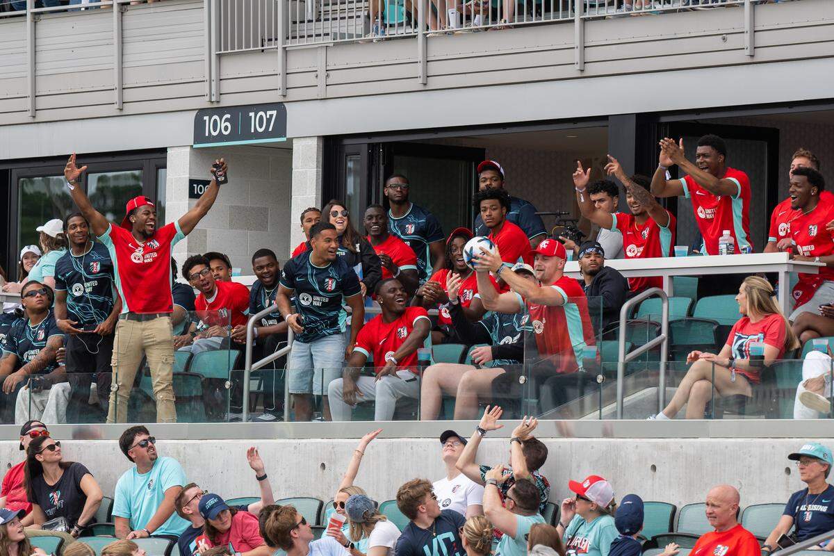 Chiefs rookies watch a teammate catch a ball kicked into the stands during the KC Current’s NWSL soccer match against the Boston Legacy on Saturday, May 30, 2026 at CPKC Stadium in Kansas City. KC won 1-0.