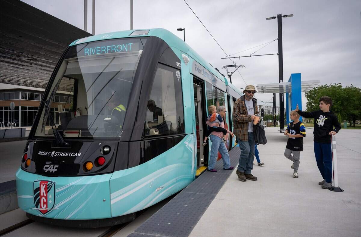 Riders disembark from the KC Streetcar at Berkley Riverfront Park on Thursday, May 21, 2026, in Kansas City. Service to the park began on May 18, 2026.