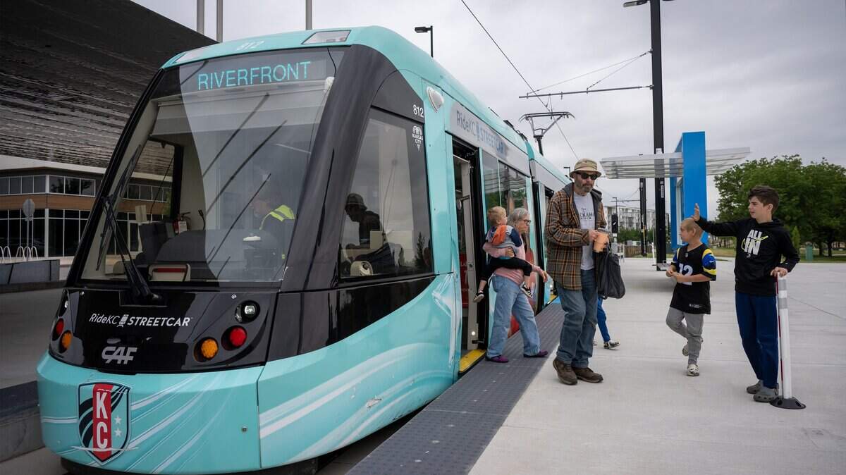 Riders disembark from the KC Streetcar at Berkley Riverfront Park on Thursday, May 21, 2026, in Kansas City. Service to the park began on May 18, 2026.