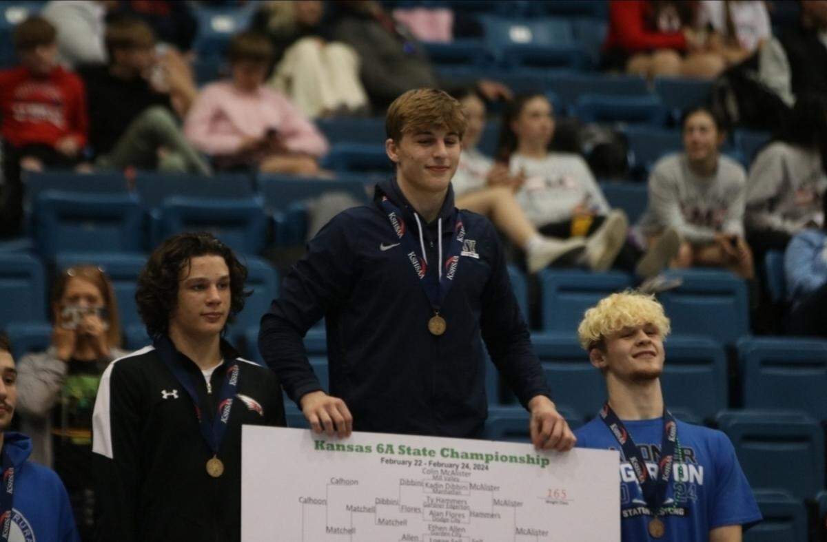 Colin McAlister of Mill Valley High School stands atop the podium at this year’s Kansas state wrestling tournament.