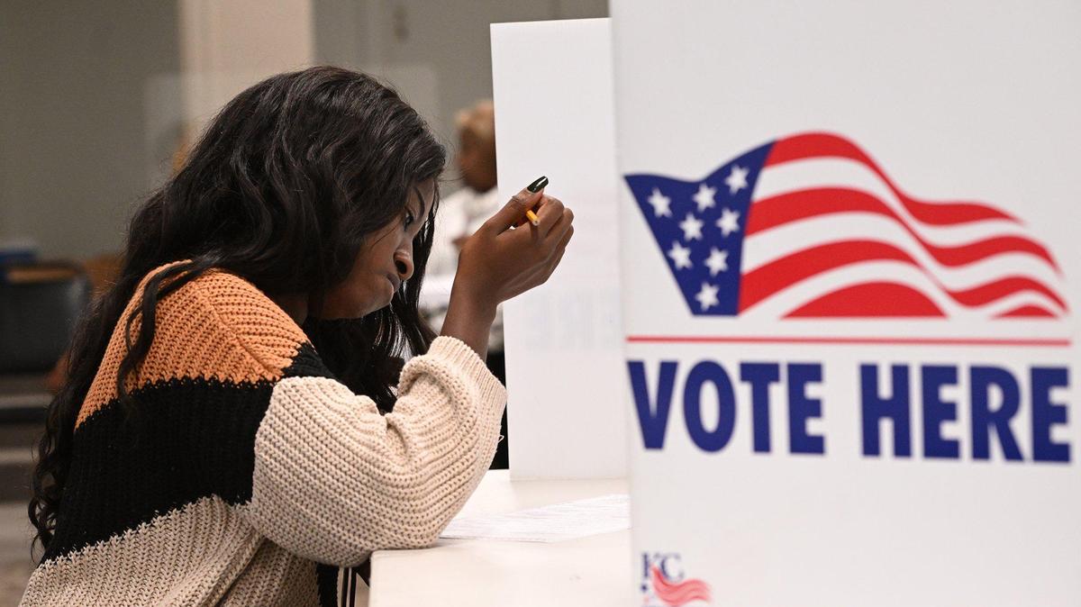 Taneka Patin, of Brookside, fills out her ballot while voting Tuesday afternoon at Wornall Road Baptist Church, 400 W Meyer Blvd., in Kansas City.