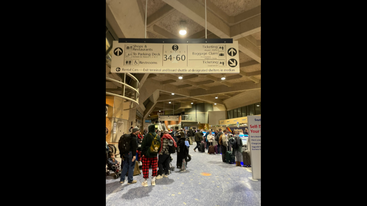 Passengers waited in long lines at Kansas City International Airport after their flights had been delayed or canceled amid Christmas travel Monday morning.
