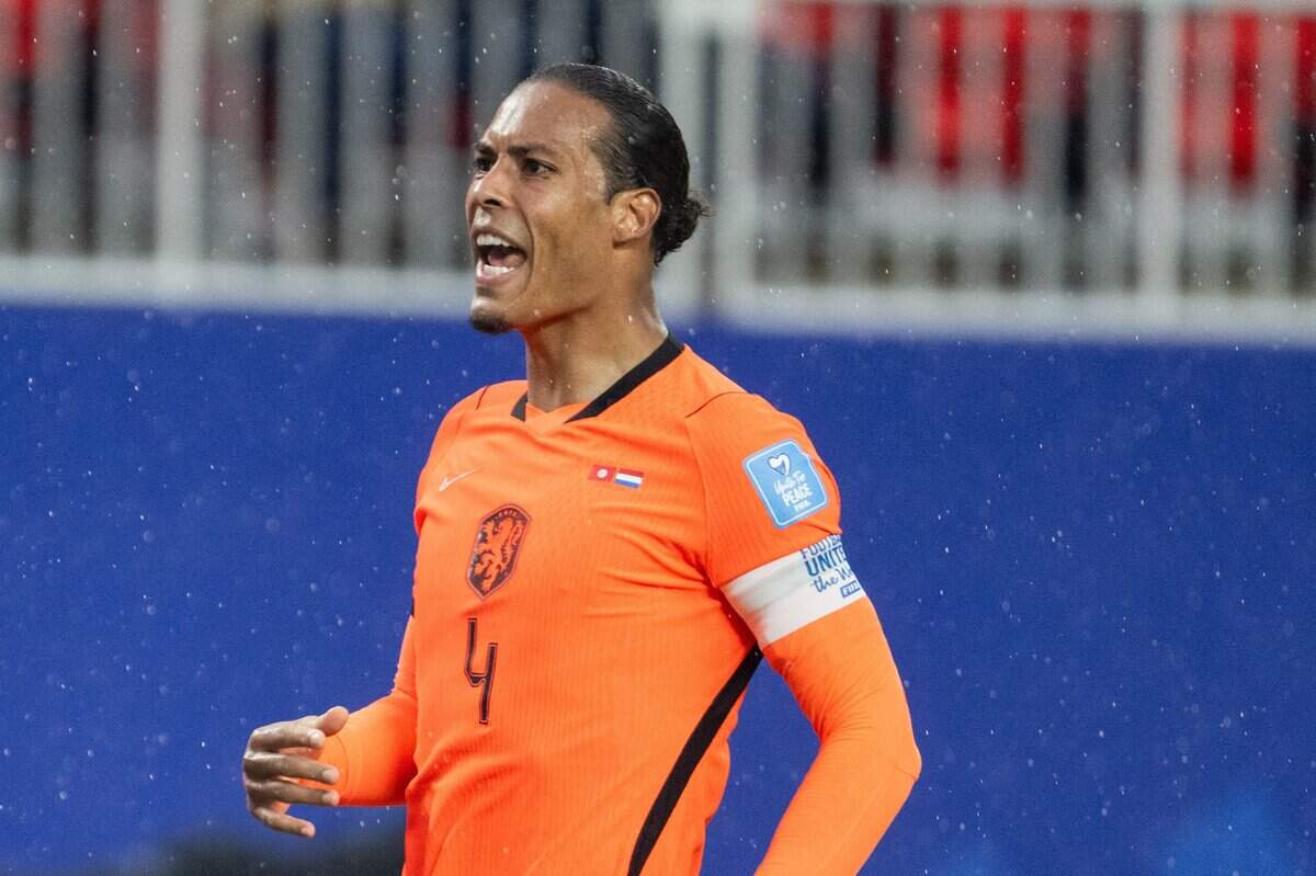 Netherlands defender Virgil van Dijk (4) yells in the rain in a FIFA World Cup group-stage soccer match at Kansas City (Arrowhead) Stadium in Kansas City on Thursday, June 25, 2026.