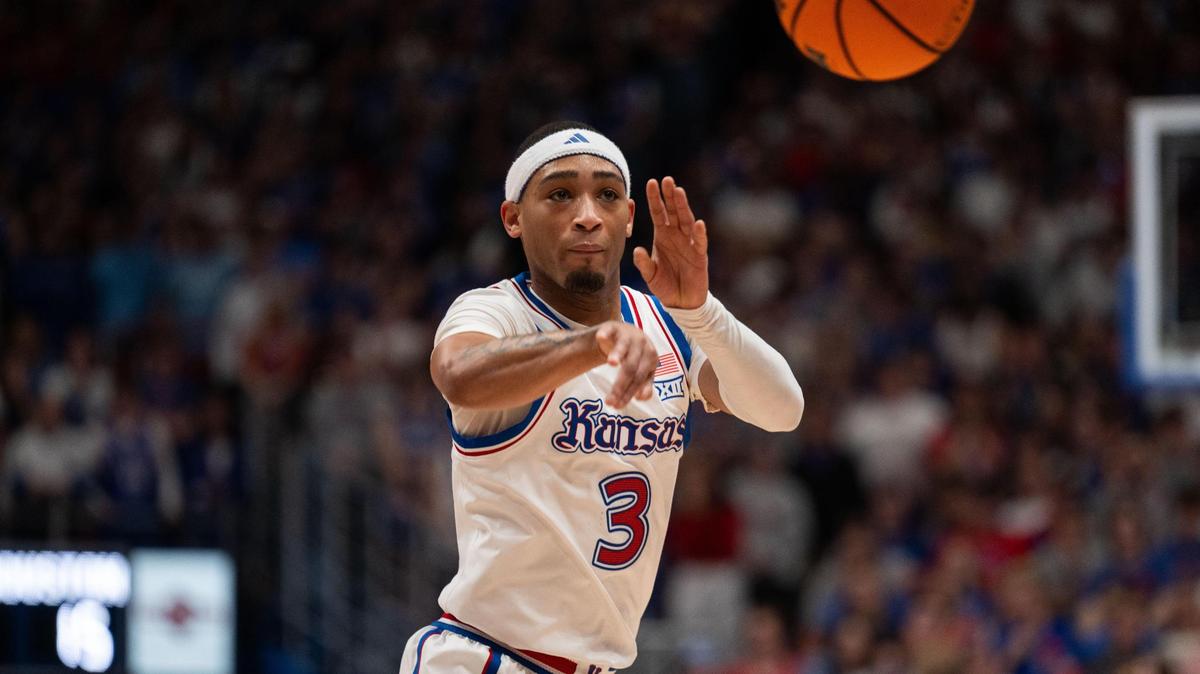 Kansas Jayhawks guard Dajuan Harris makes a pass to the wing in the first half of the game vs. the Houston Cougars on Saturday, Jan. 25, 2025, at Allen Fieldhouse.