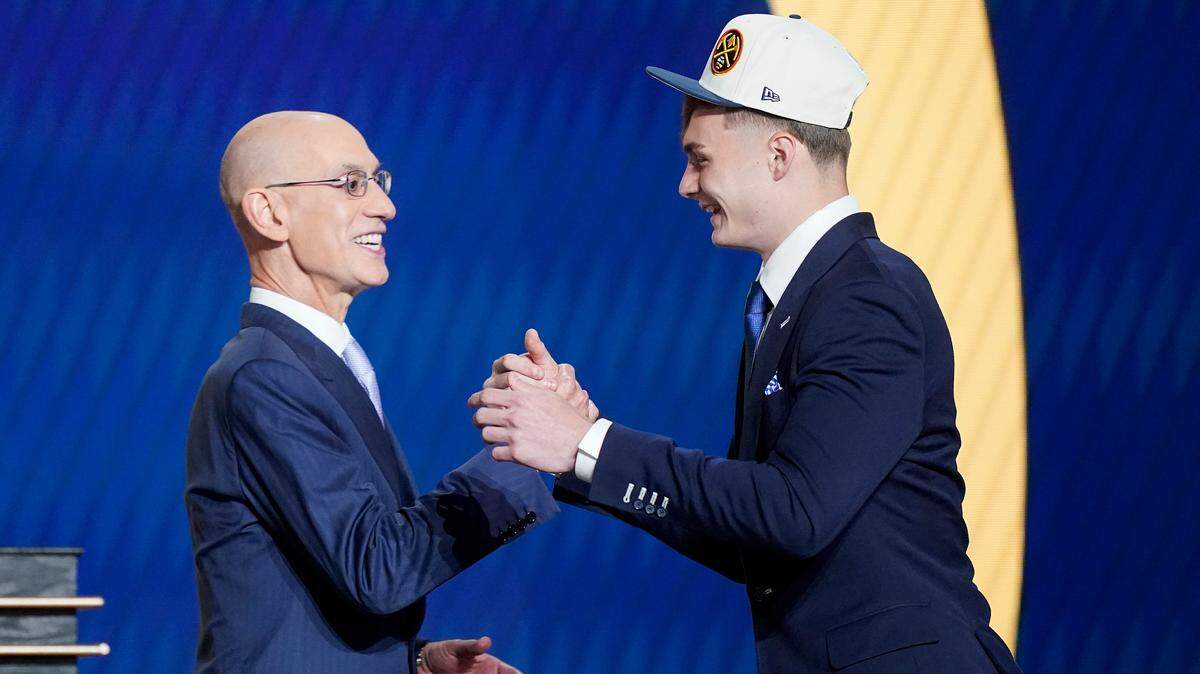 Christian Braun was congratulated by NBA Commissioner Adam Silver after being selected 21st overall by the Denver Nuggets in the 2022 NBA Draft in New York.
