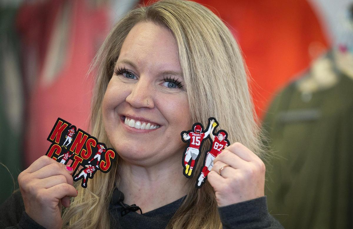 Owner Melissa Wassergord displays some of the Chiefs-themed patches she designed and sells at the “patch bar” at her store, Maxi Laine’s Boutique in Olathe.