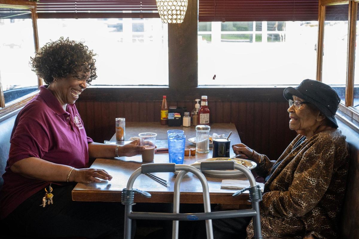 Denise Ward, left, founder of Niecie’s, chats with her mother, Theris Griffin, who was enjoying breakfast at the restaurant one recent morning.