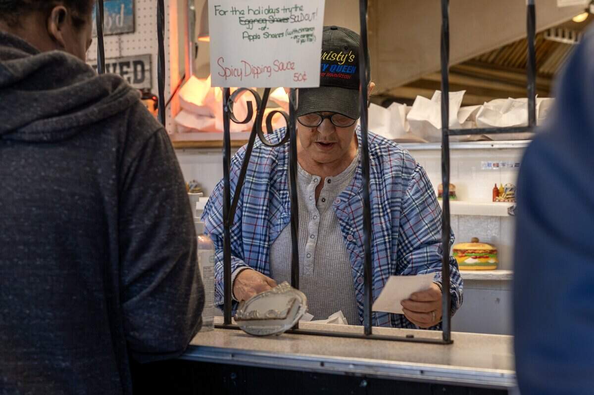 Sheri Owens takes orders at Christy's Tasty Queen on Wednesday, Feb. 18, 2026, in Kansas City, Kansas. The restaurant is marking its final day under its founding owners.
