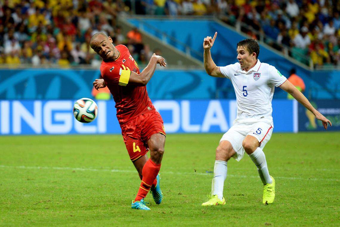 U.S. defender Matt Besler, right, challenges Belgium’s Vincent Kompany for the ball during a group-stage soccer match at the 2014 FIFA World Cup in Recife, Brazil.