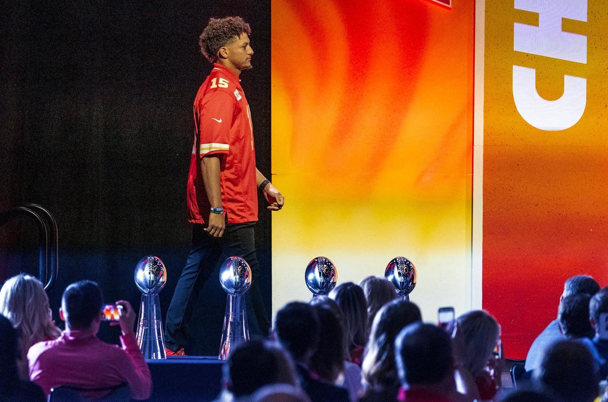 Chiefs quarterback Patrick Mahomes is introduced and walks past the team’s four Lombardi trophies during the 2024 Chiefs Kickoff Luncheon.