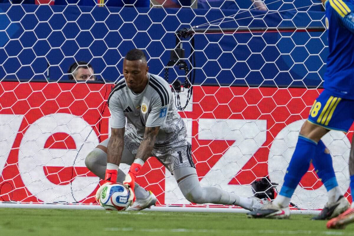Curaçao goalkeeper Eloy Room (1) makes a save in a FIFA World Cup group-stage soccer match at Kansas City (Arrowhead) Stadium in Kansas City on Saturday, June 20, 2026.