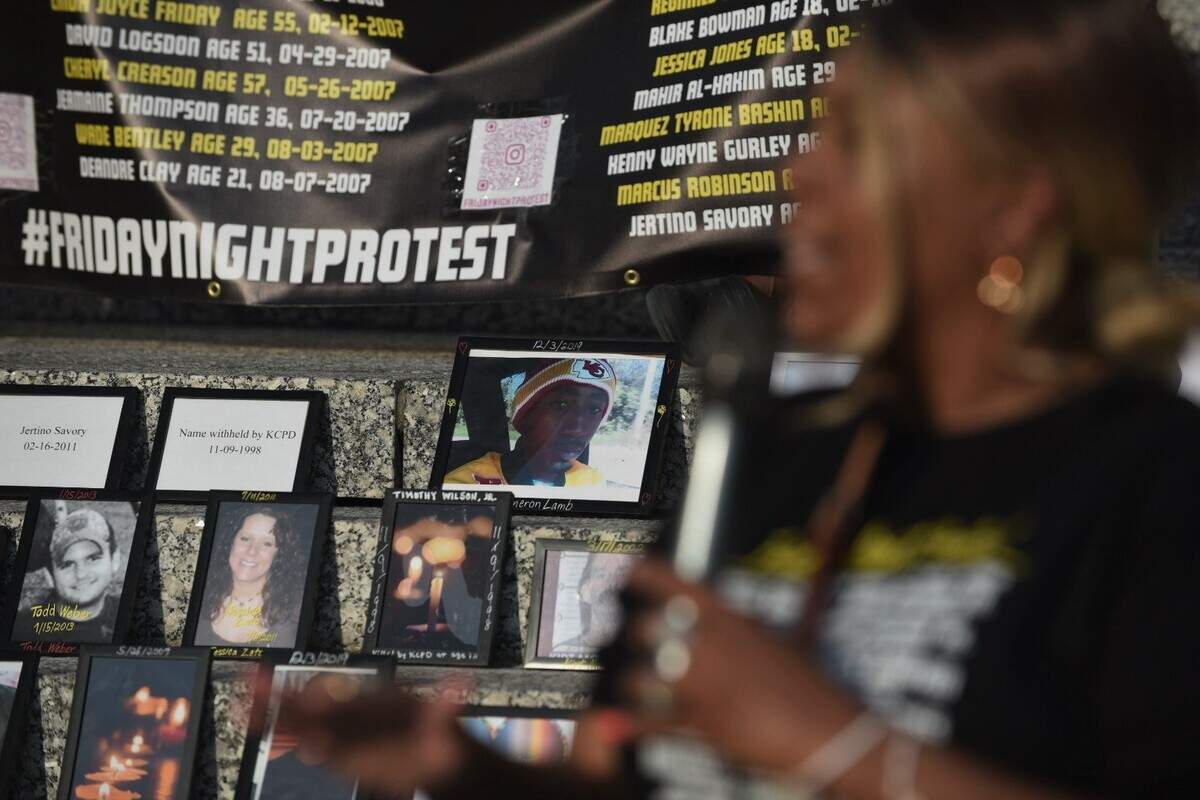 A framed photograph of 26-year-old Cameron Lamb, who was fatally shot in December 2019 by Kansas City police detective Eric DeValkenaere, sits on the steps of Kansas City Police Department headquarters as Lamb’s mother, Laurie Bey, speaks to demonstrators on Friday June 10, 2022. DeValkenaere was later convicted of involuntary manslaughter and armed criminal action.
