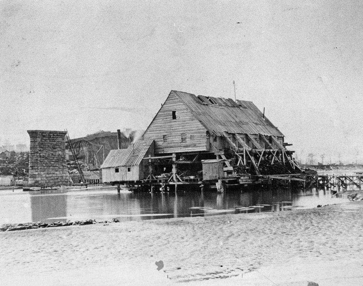 Bottom falsework is seen on Pier No. 4 as the Hannibal Bridge nears completion on March 2, 1869. Falsework is the name given to the temporary stuctures built to support bridge the bridge while under construction.