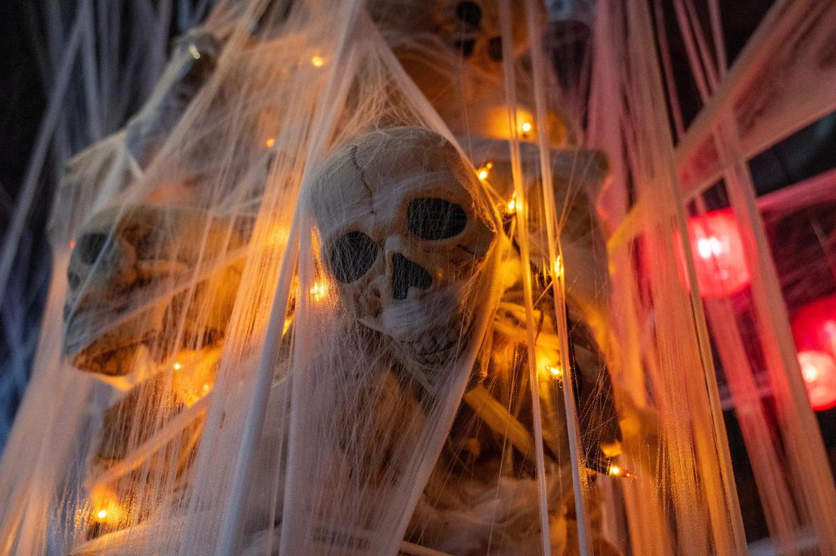 Cobwebs surround a decorative skeleton near the dining area at Cafe Trio in 2023.