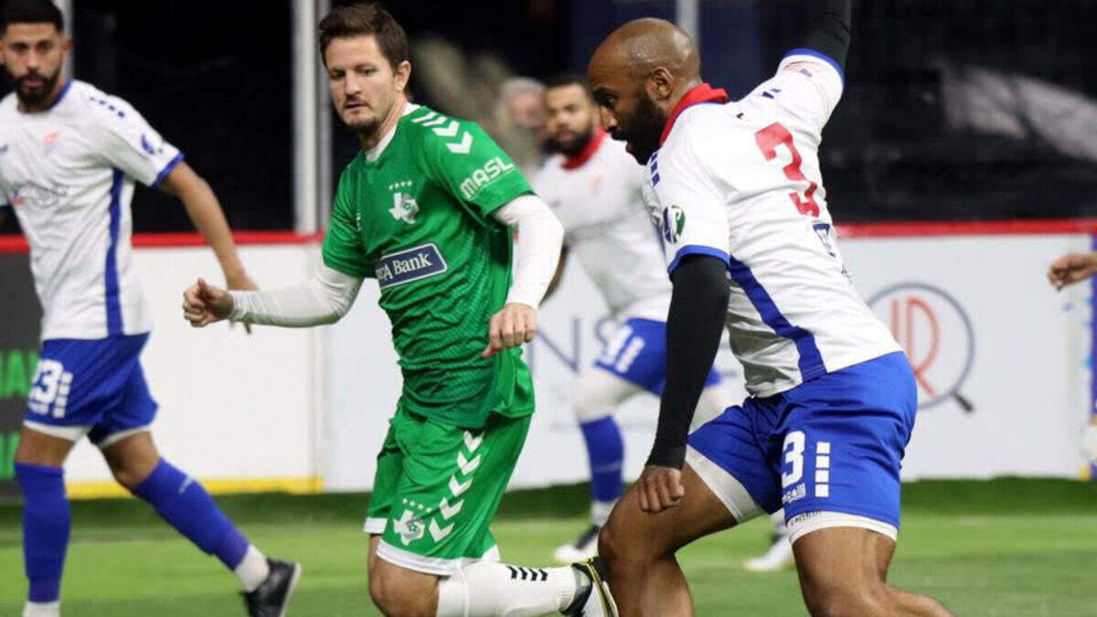 Kansas City Comets defender Ray Lee, right, works the ball up the field during a recent game against the Dallas Sidekicks in Texas.