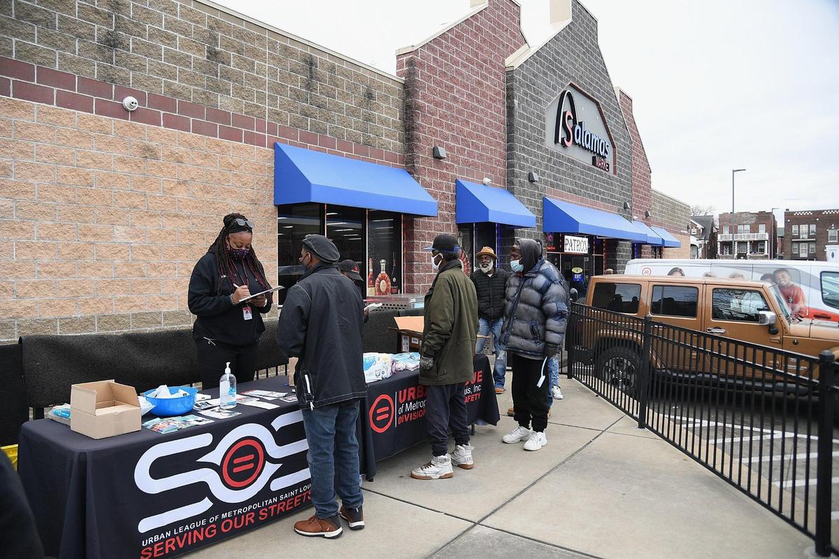 Visitors gather at a site where the “Serving Our Streets” initiative offers services in St. Louis. The group hopes to expand its Grill to Glory event – an effort where over 100 religious leaders simultaneously barbecue every Saturday across the metro area.