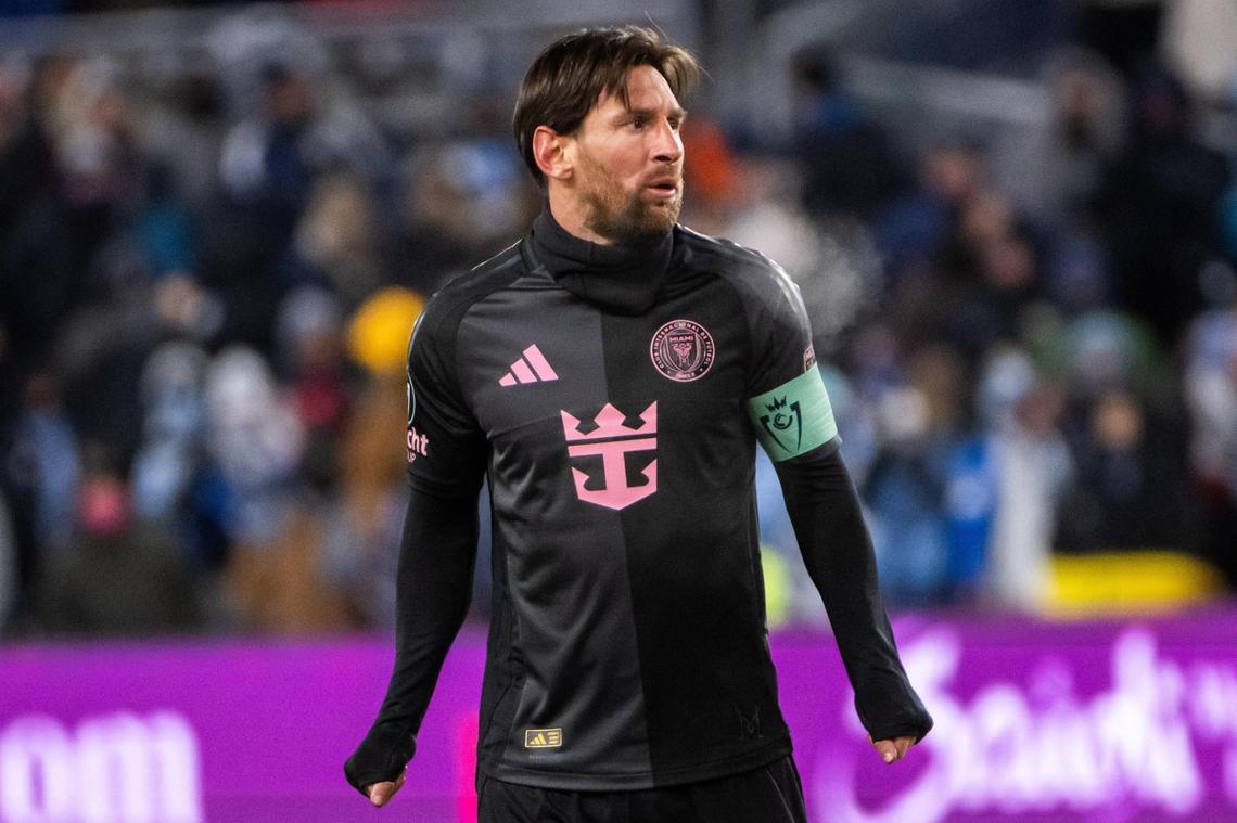 Inter Miami CF forward Lionel Messi holds his hands in his shirt to keep them warm in the second half of the Concacaf Champions Cup match vs. Sporting Kansas City on Wednesday, Feb. 19, 2025, at Children’s Mercy Park. The wind chill for the game was in the negatives.