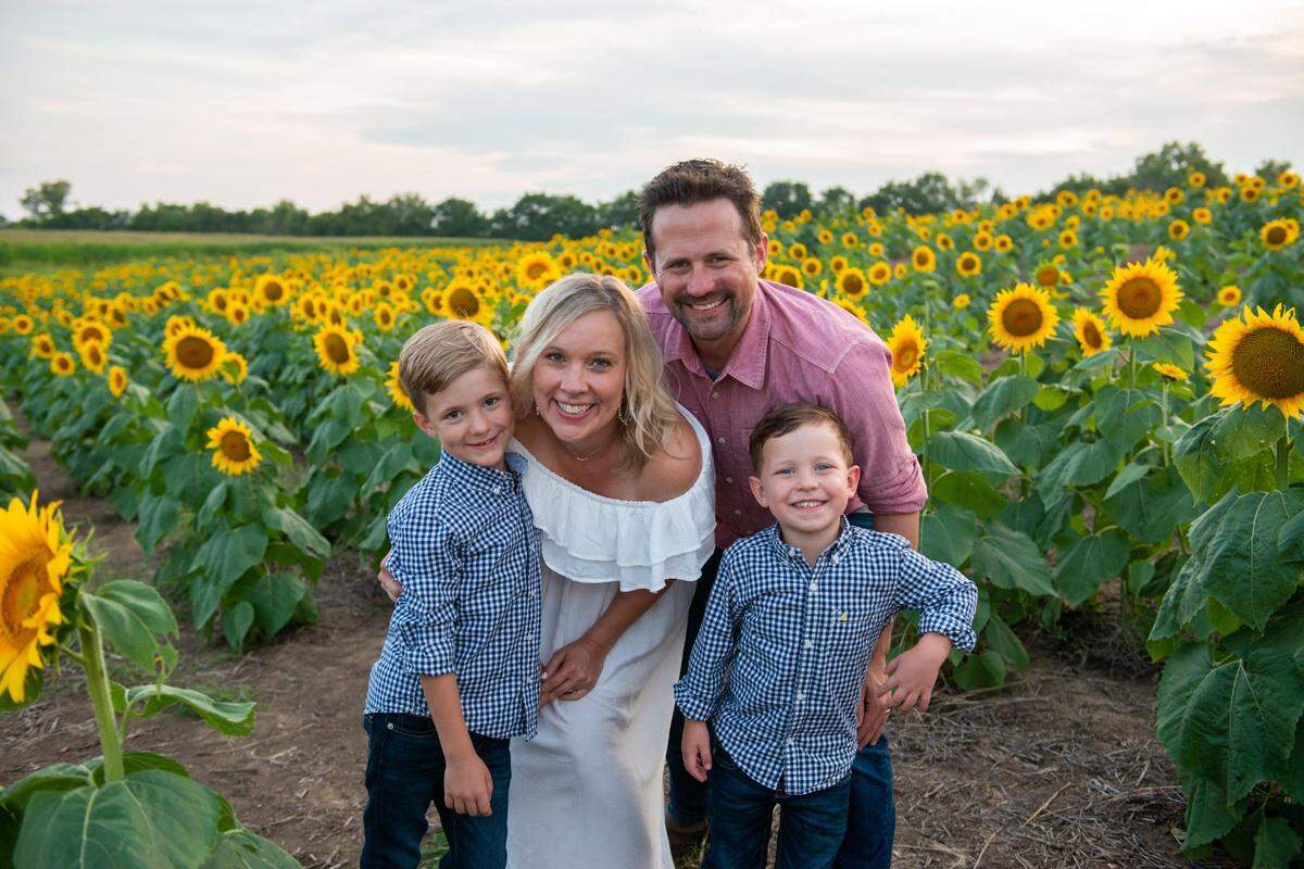 Shawnee Mission school district mom Skylar Bellinger is unsure what the first day of kindergarten will look like for her youngest son, Weston, 5, on the right. She is shown here with her husband, Joe, and their oldest son, Henry who is 8.
