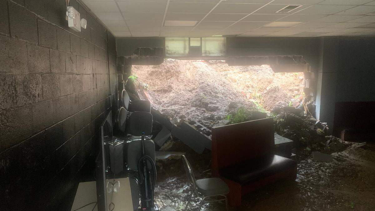 Wall collapse at McNewton’s Outreach Community Center as a result of a mudslide.