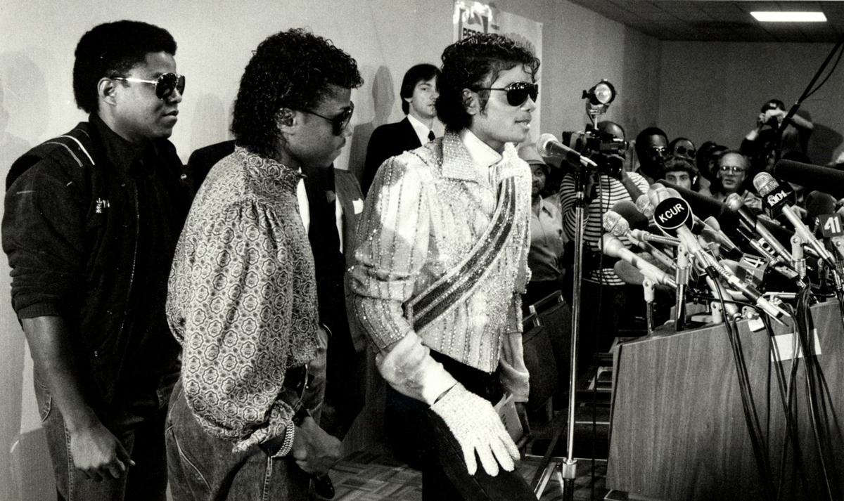 Michael Jackson, accompanied by brothers Tito, left, and Marlon, addressed reporters during a news conference at the Westin Crown Center on July 5, 1984.