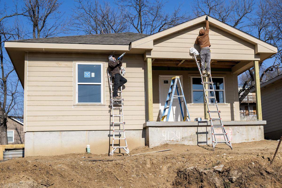 Construction volunteers work on a Habitat for Humanity home in Kansas City's Lykins neighborhood on Tuesday, Dec. 16, 2025.