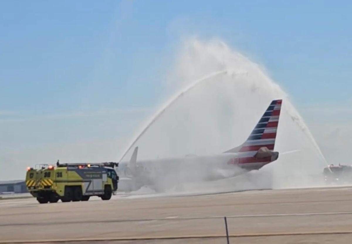 A water salute at Kansas City International Airport honors the arrival of the remains of Capt. Hall Stratton, a fighter pilot who died in Korea in 1951.