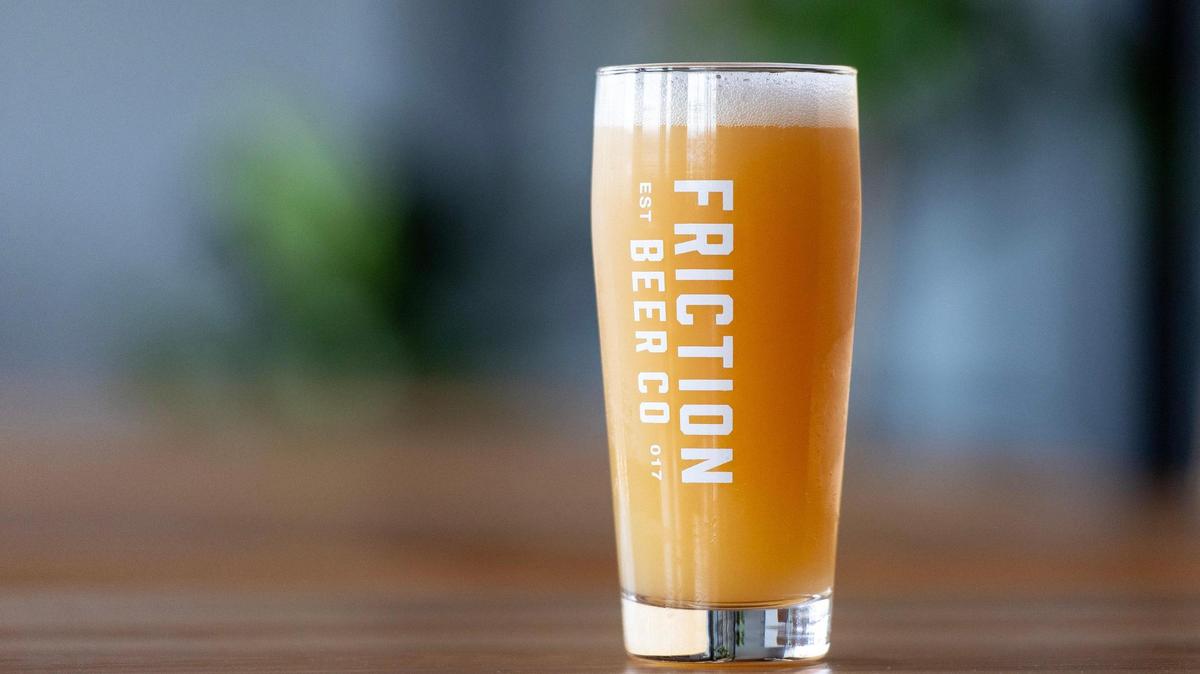 Friction Beer Co.’s take on a strawberry blond ale, named Dr. Feelgood, is on tap at the newly opened bar in Shawnee.