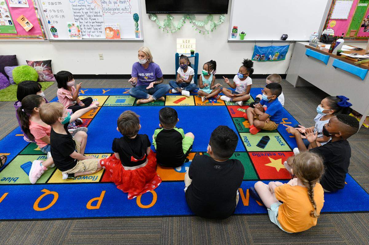 Kansas City, Kansas, students, including kindergartners at Hazel Grove Elementary School, are required to wear masks as COVID-19 cases surge.
