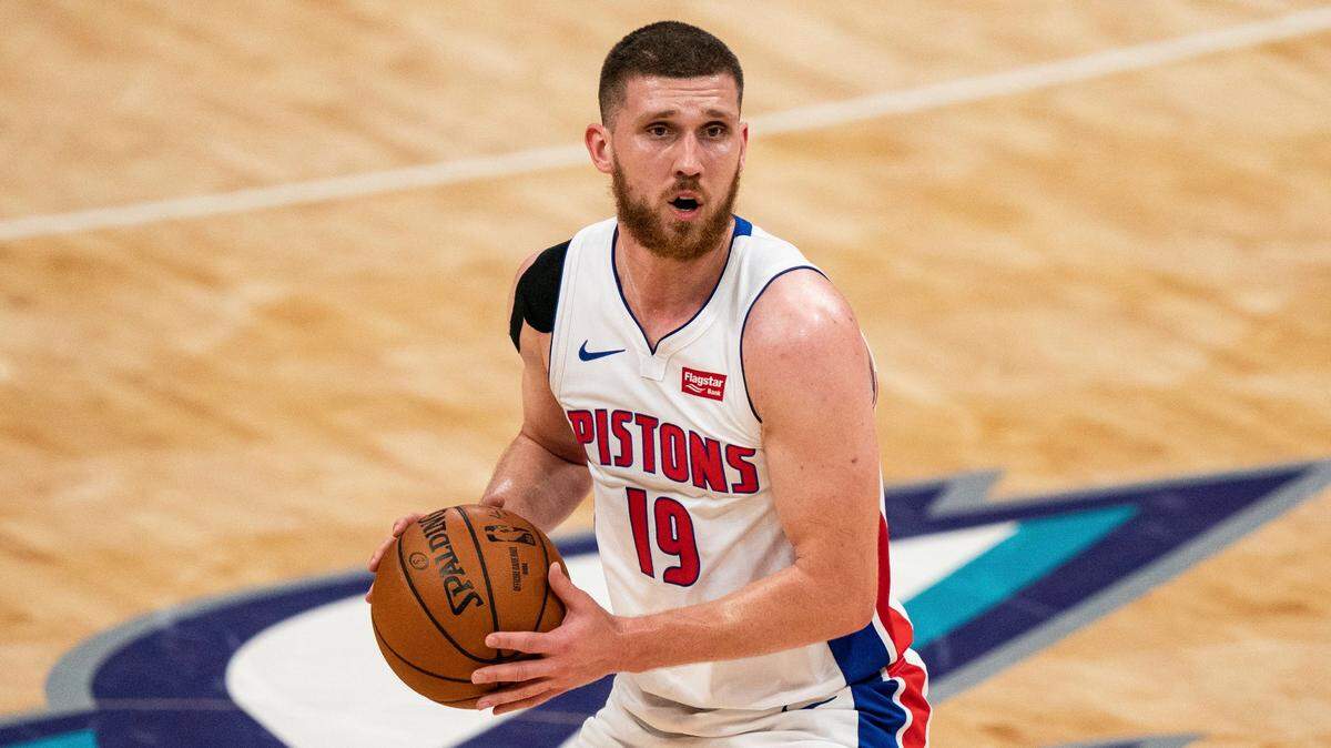 Former Detroit Pistons guard Svi Mykhailiuk brings the ball upcourt against the Charlotte Hornets during an NBA game in Charlotte, N.C.