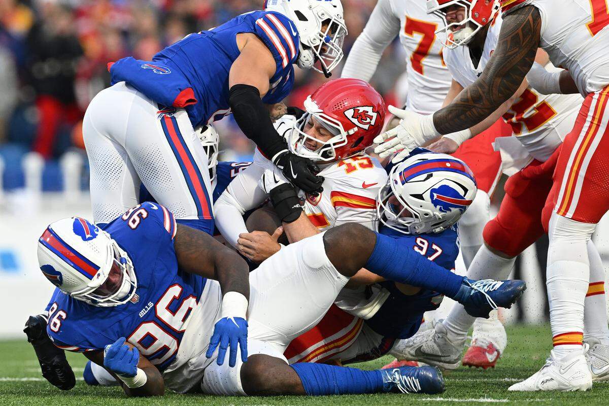 Kansas City Chiefs quarterback Patrick Mahomes (No. 15) is tackled by Bills defensive lineman Joey Bosa (No. 97) during an NFL Week 9 game at Highmark Stadium in Orchard Park, New York, on Sunday, Nov. 2, 2025.