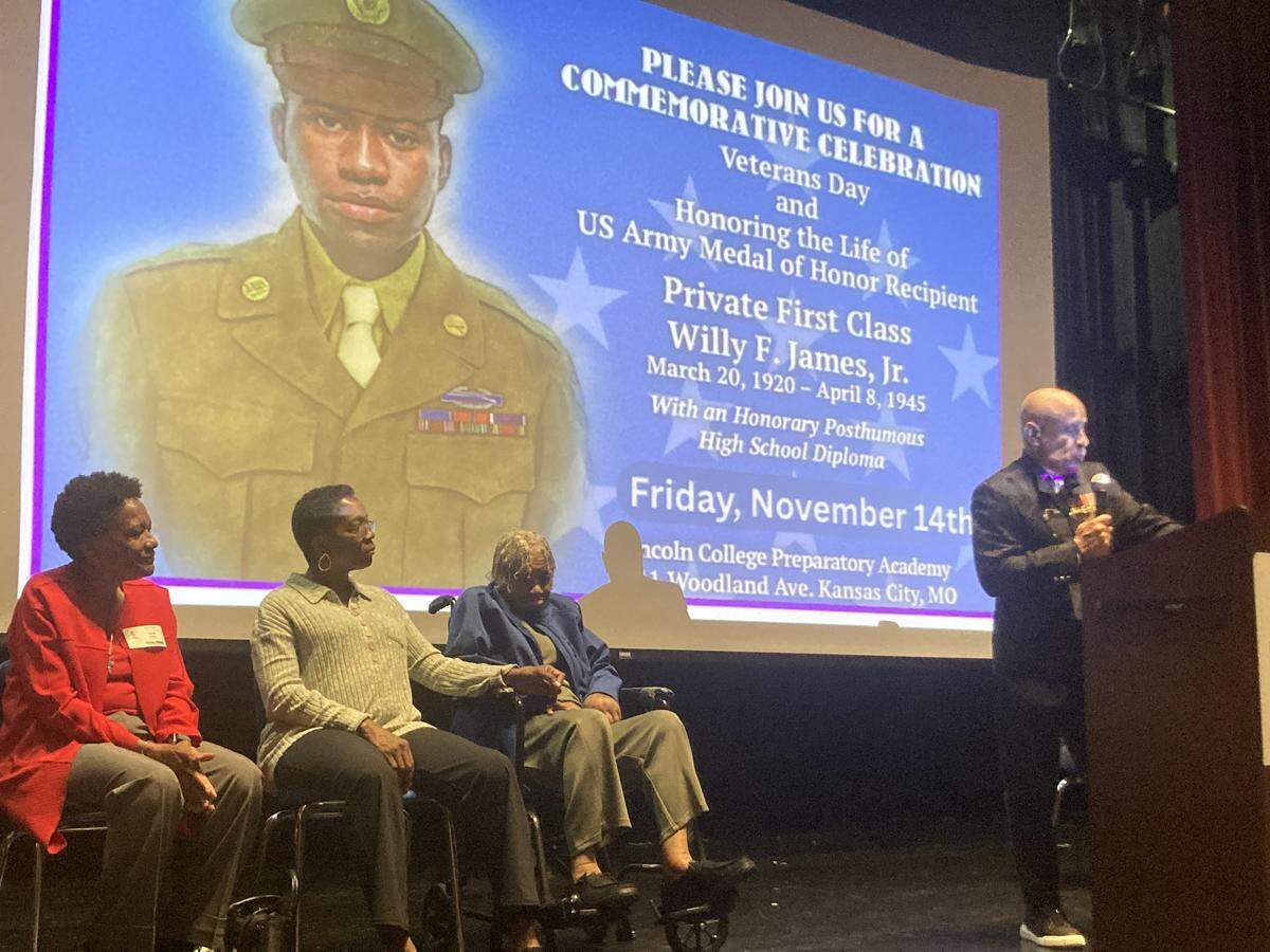Ret. 1st Sgt. Robert Gray, III, of the U.S. Marine Corps, speaks to students at Lincoln College Preparatory Academy about Medal of Honor recipient Willy F. James, Jr. before his honorary high school diploma is presented to his sister, Elizabeth Baldwin, age 104.