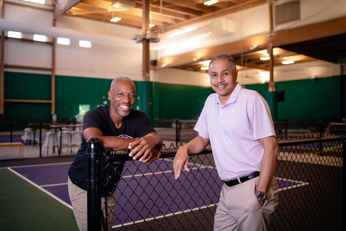 Former tennis pro Daryl Wyatt (left) and Emmett Pierson of Community Builders Kansas City partnered on SW19 at the Stadium.