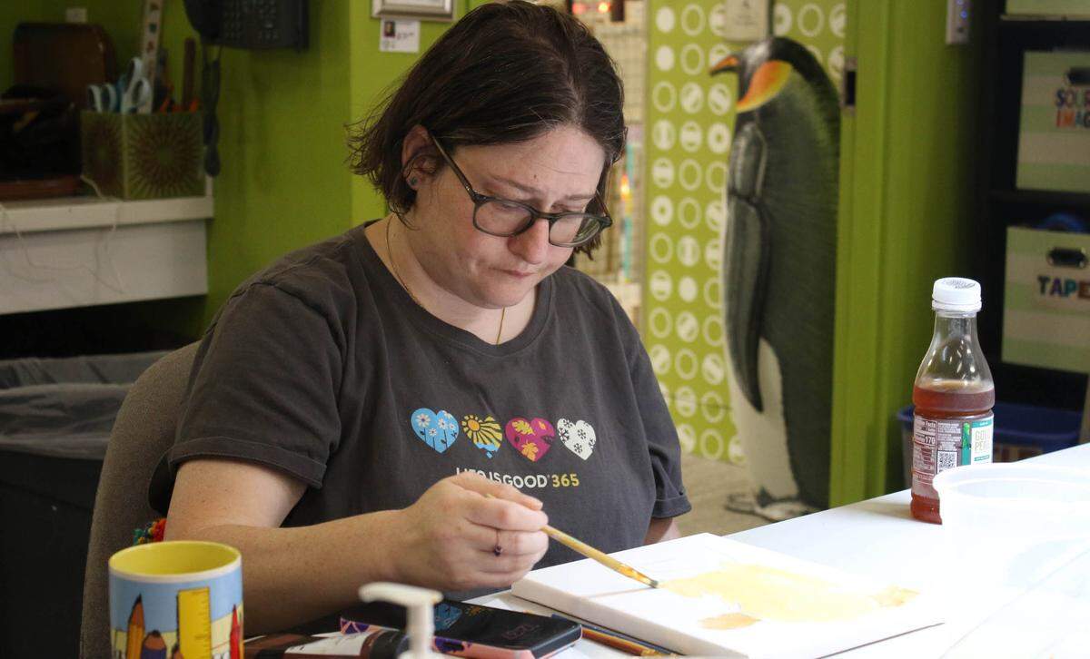 Amy Isenberg works on her art in a studio at the Johnson County Arts and Heritage Center as part of the Emerging Artists program.