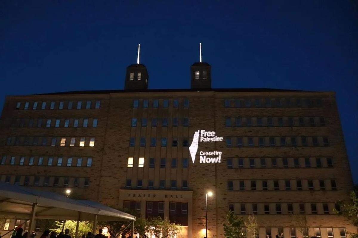 An image was projected onto Fraser Hall by student activists at the University of Kansas in May 2024.