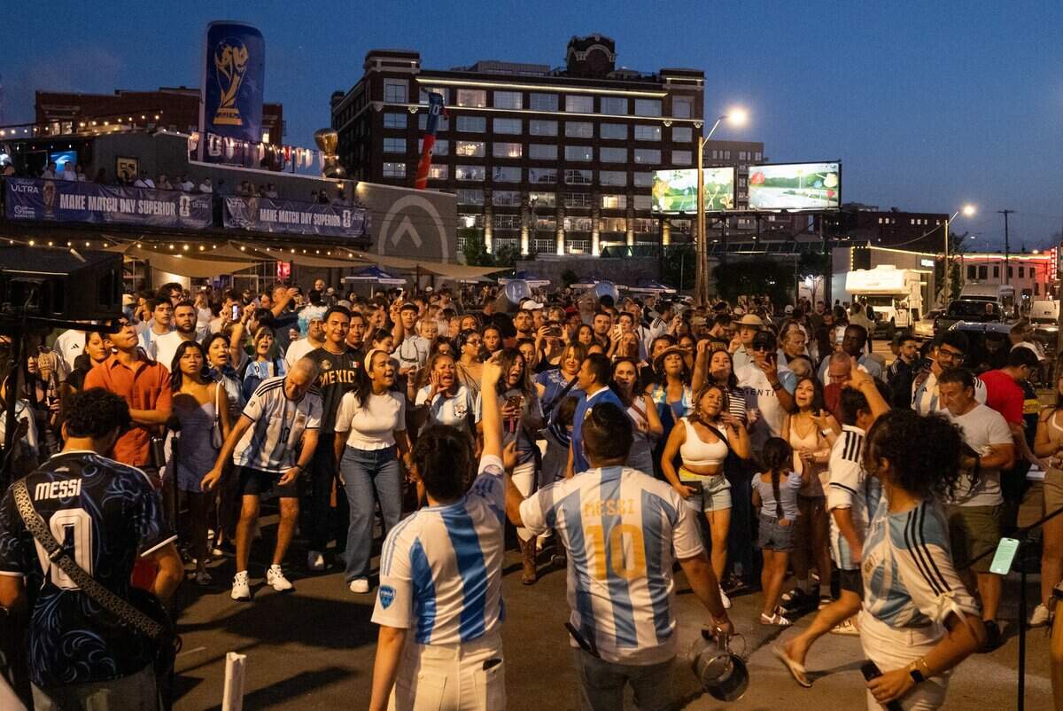 Argentina fans dance during a rally outside Cafe Corazon in the Crossroads on Friday, June 10, 2026. Argentina and superstar Lionel Messi will face Switzerland at Kansas City Stadium on Saturday for a chance to advance to the semifinals of the World Cup.