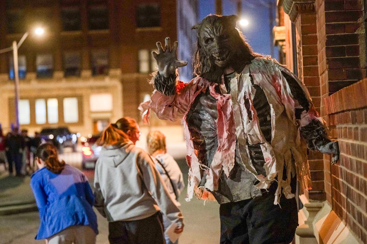 Wolfie the Wolfman scares passersby outside The Beast in West Bottoms.