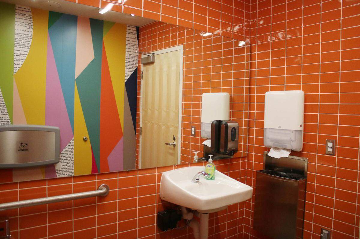 Bits of text from Winnie the Pooh books keep even the bathrooms focused on literacy at Merriam Plaza Library.