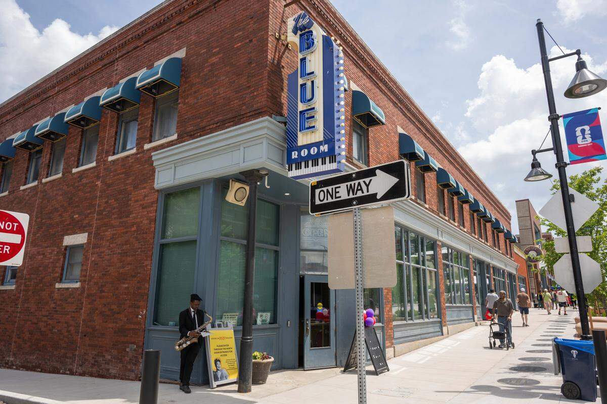 A jazz saxophonist stands outside the Blue Note in the 18th & Vine Jazz District on Wednesday, May 27, 2026, in Kansas City.