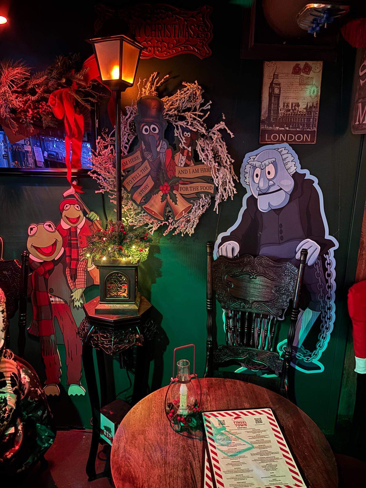 A portion of the Tom’s Town downstairs bar features characters from “The Muppets Christmas Carol.” Dec. 4, 2025.