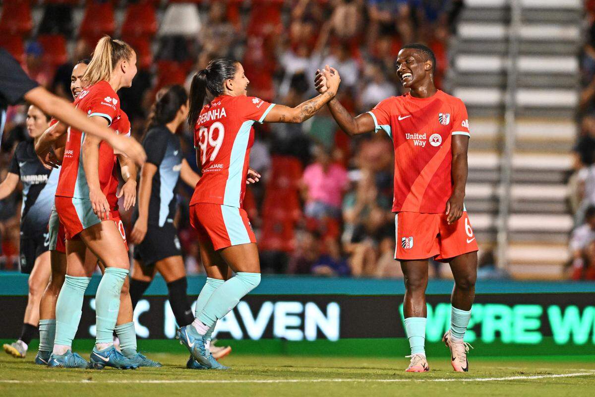 Kansas City teammates congratulate Current forward Temwa Chawinga, right, after one of her first-half goals against Gotham FC during Friday night’s Summer Cup final at Toyota Field in San Antonio.